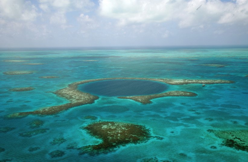 What did divers discover in Belize’s Great Blue Hole?